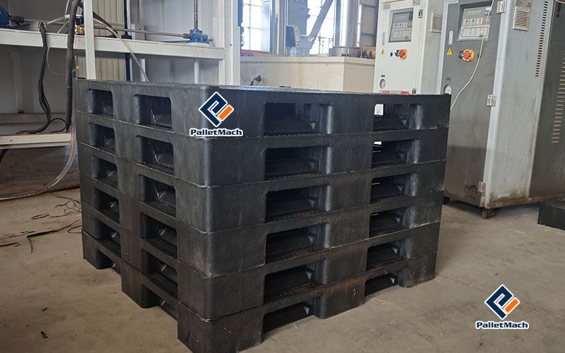Finished one-piece moulded plastic pallet pressed from mixed waste plastic during the acceptance test