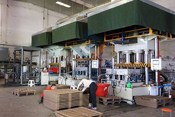 Automatic pressed wood pallet production line